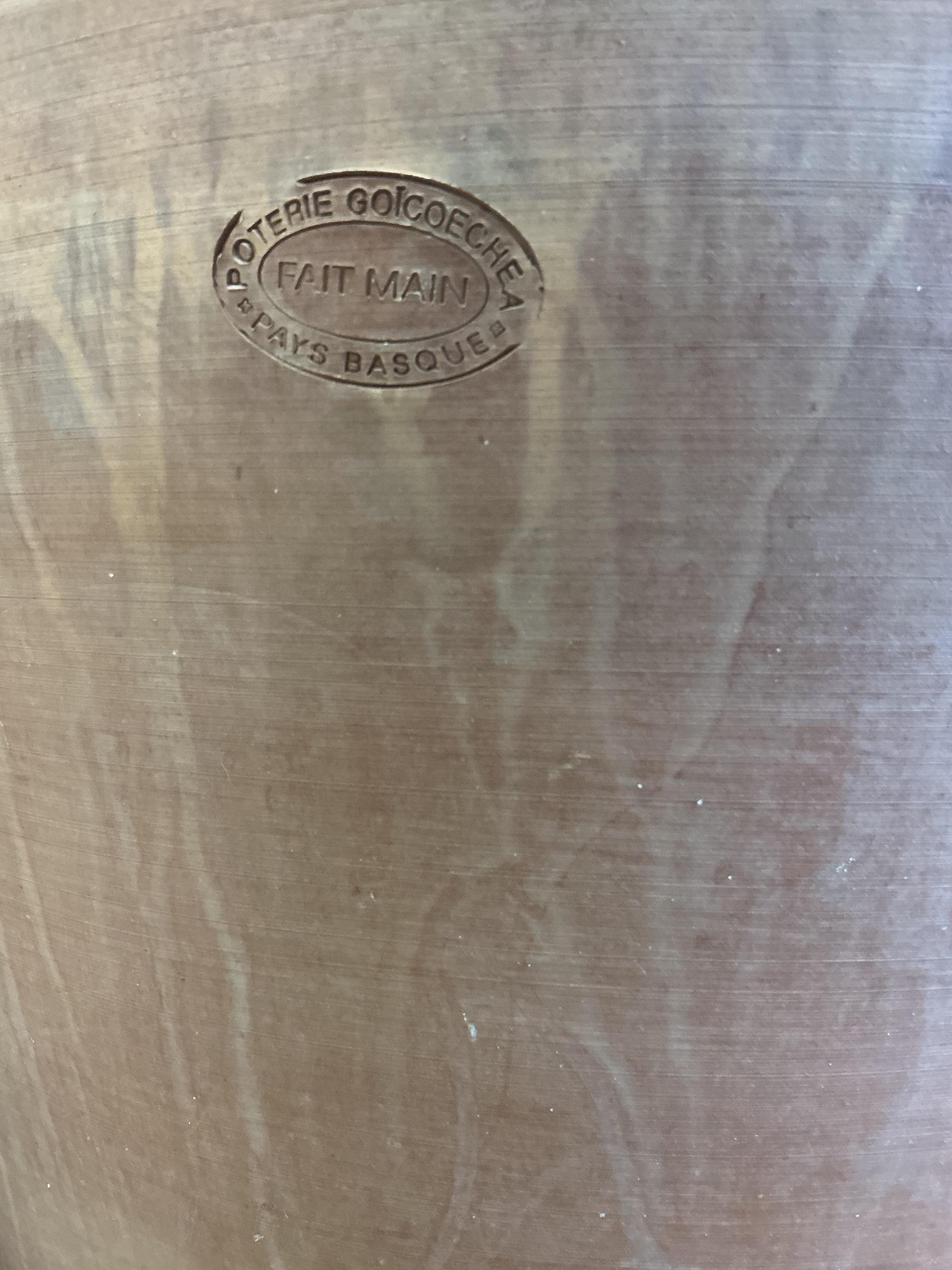 A pair of Goicoechea circular pottery planters with tray bases, diameter 54cm, height 53cm